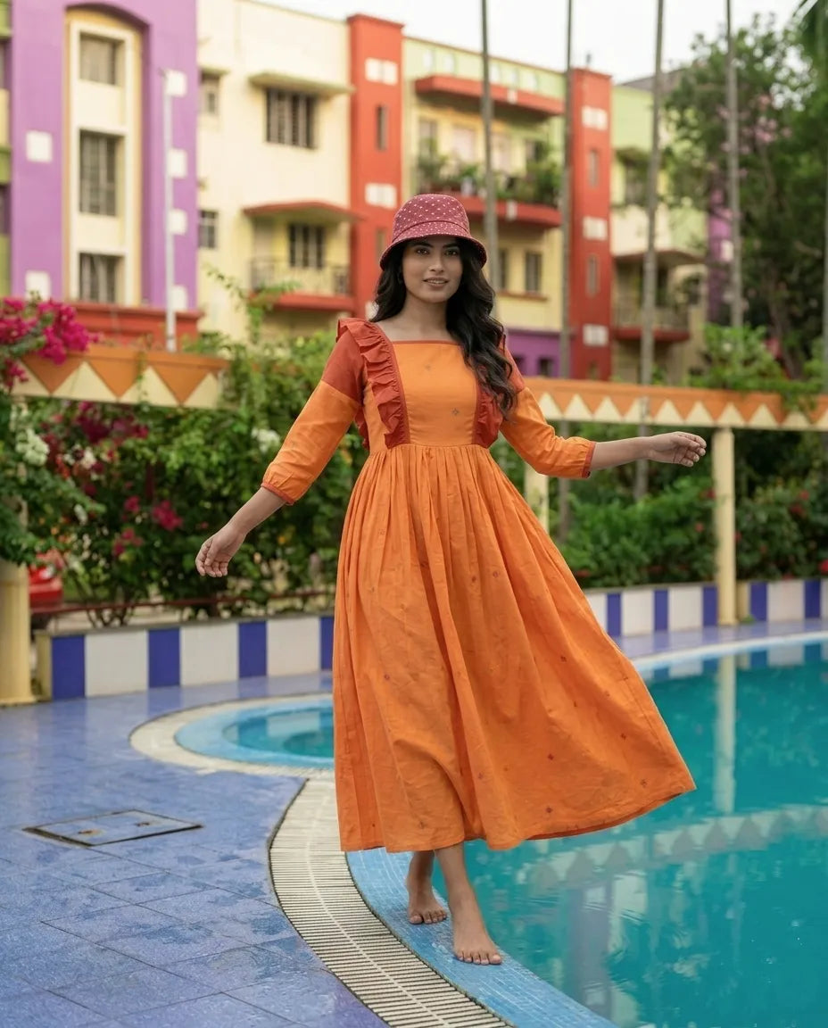 SOIRES- Handwoven Muslin Cotton Flared Jamdani Maxi Dress with Frill Detailing.