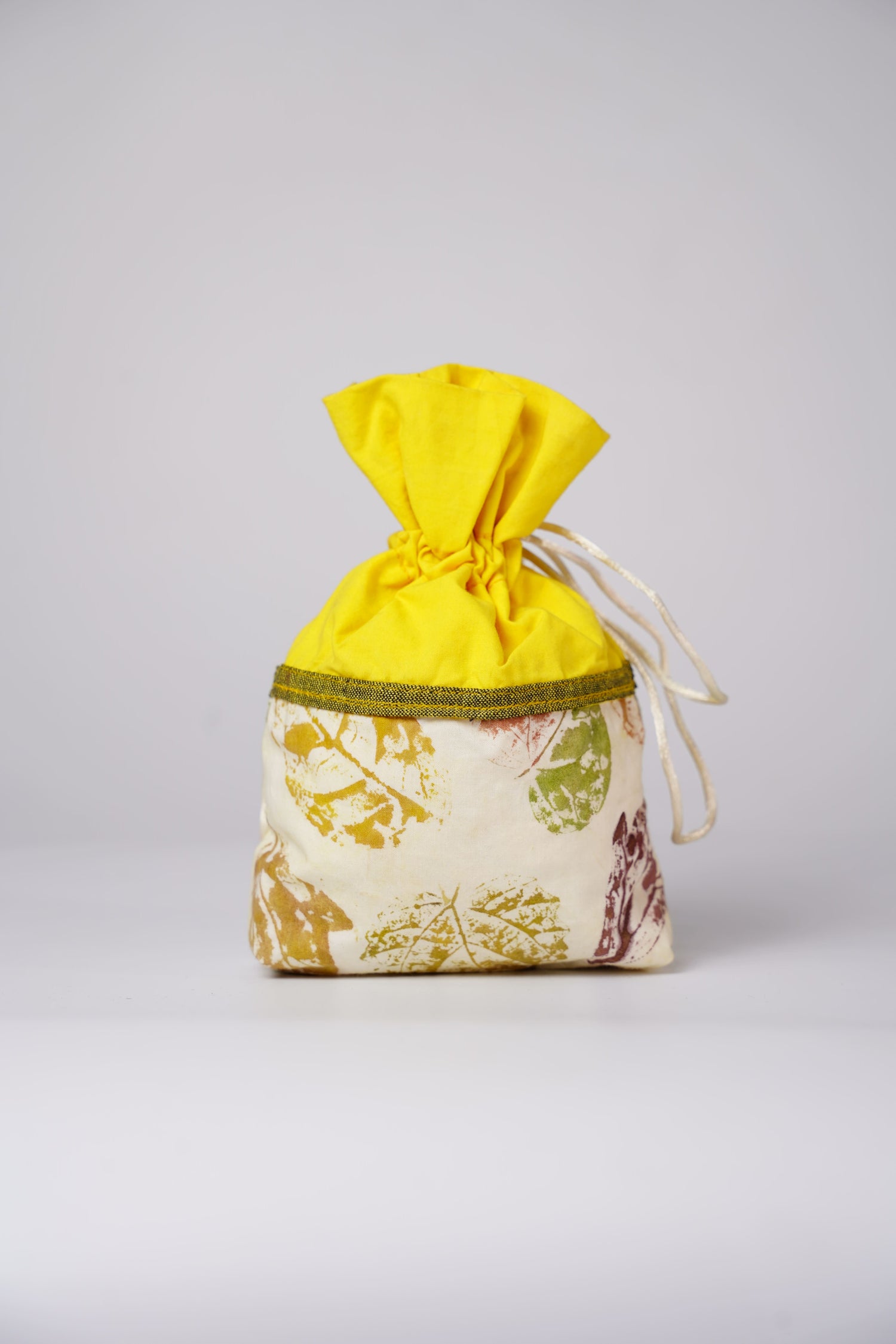 handmade fabric drawstring potli bag with leaf print