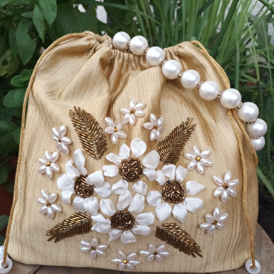 Gold hand embroidered wedding potli