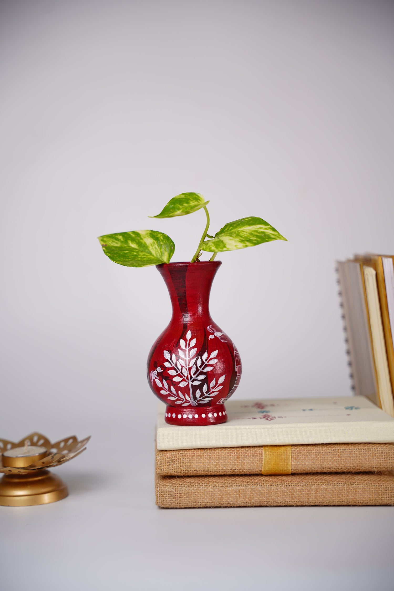 handcrafted red terracotta flower vase with white Warli art hand-painting.