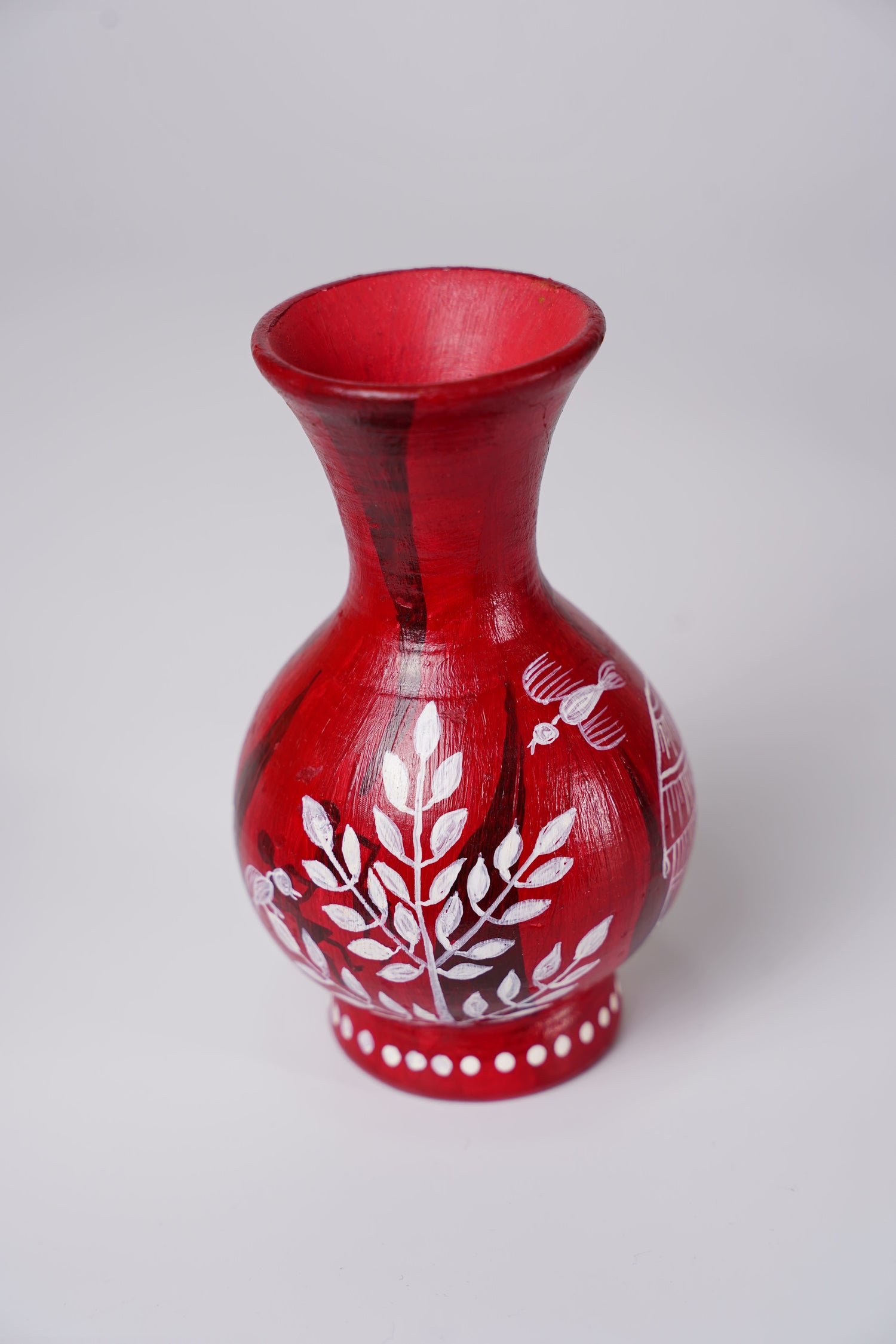 handcrafted red terracotta flower vase with white Warli art hand-painting.