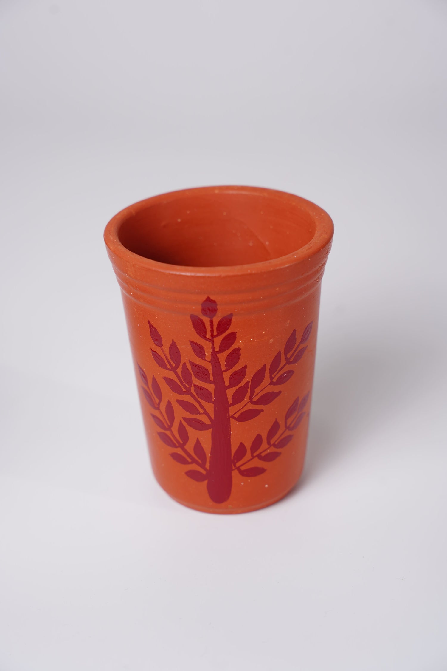 terracotta or clay glass with handpainted Warli