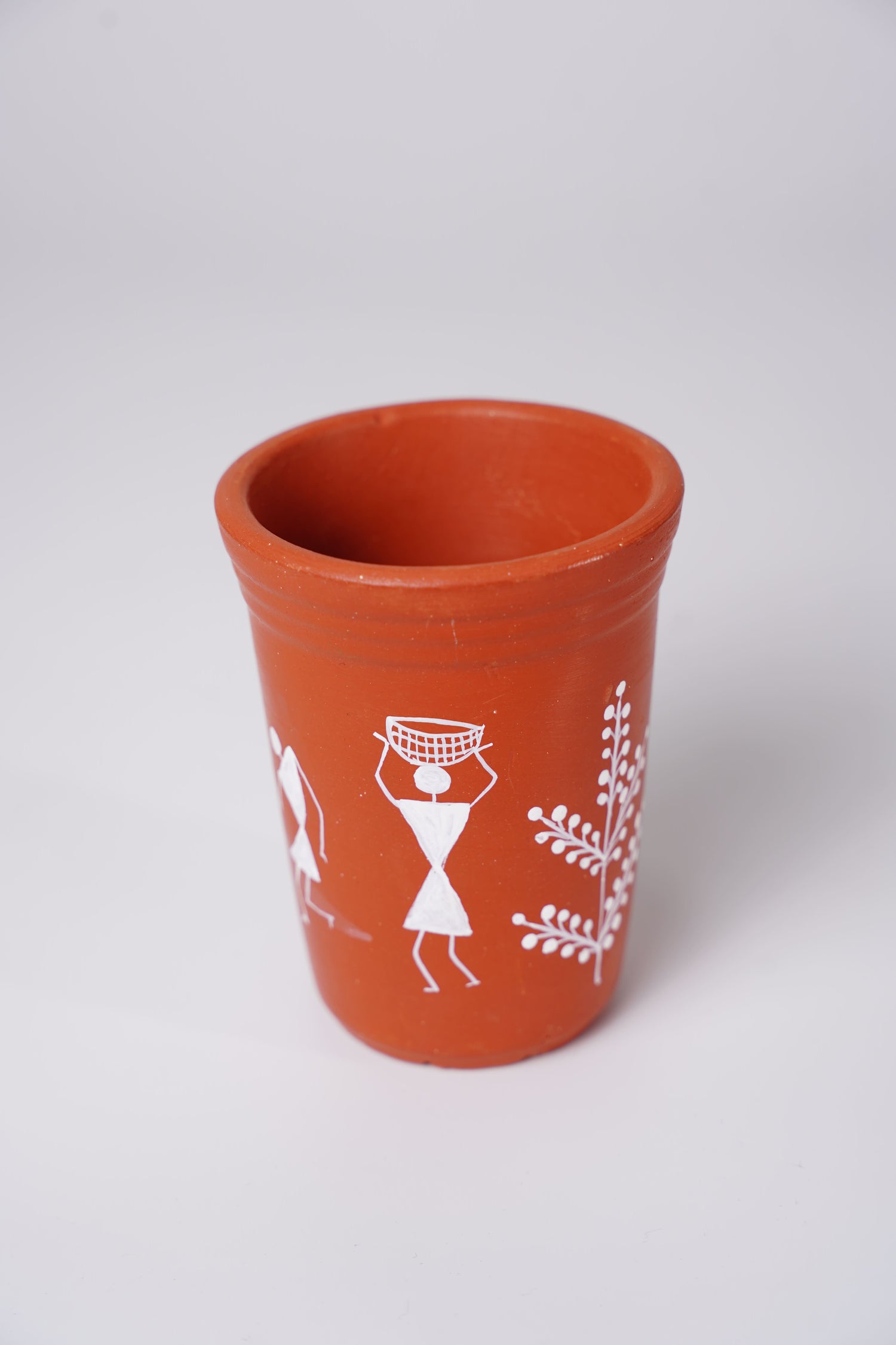 terracotta or clay glass with handpainted Warli