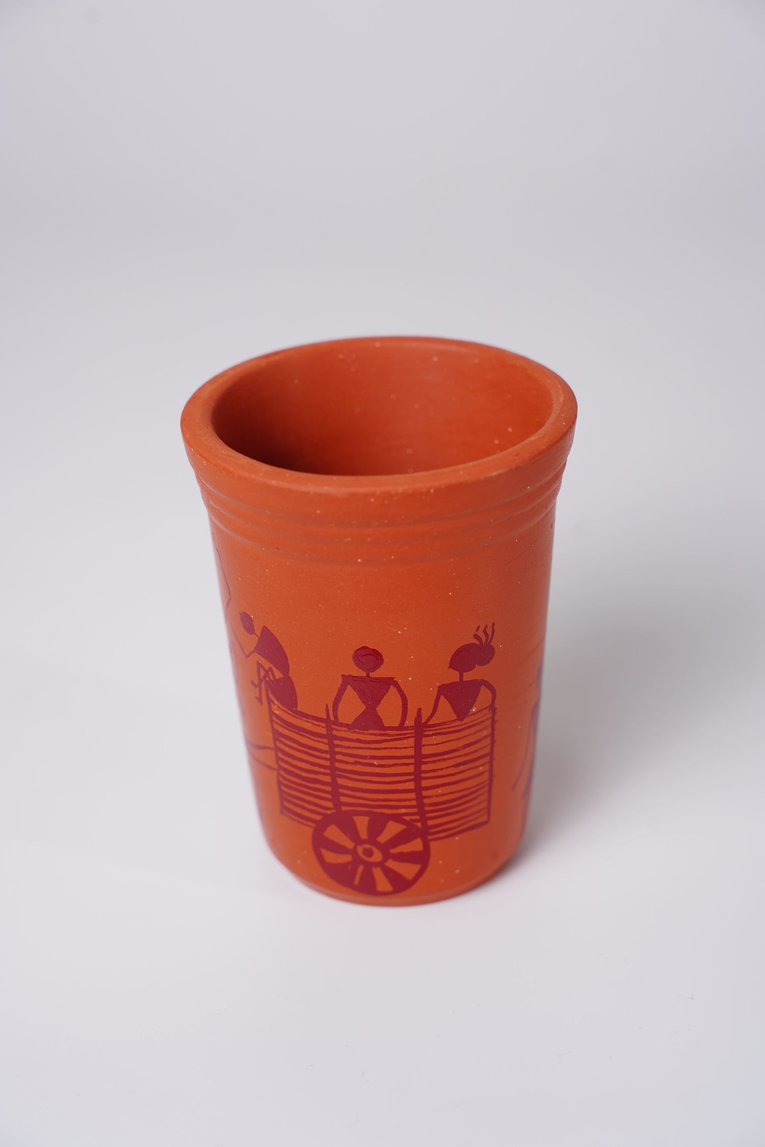 terracotta or clay glass with handpainted Warli