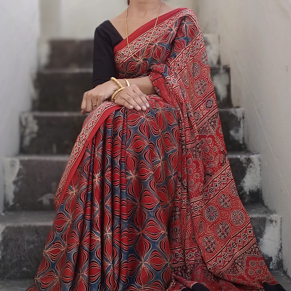 Exclusively Hand Block printed Natural Dyed Ajrakh Modal silk saree.